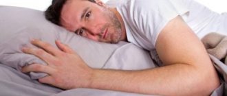 A man lies on a pillow